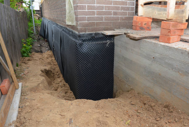 Happy homeowners after waterproofing job in Minneapolis
